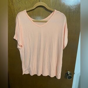 Women’s Iman peach colored short sleeve top.  Size XL.